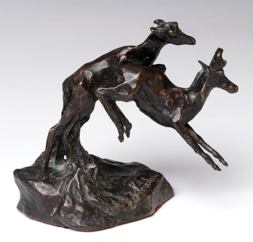 A 20TH C. BRONZE SCULPTURE LEAPING PRONGHORN 