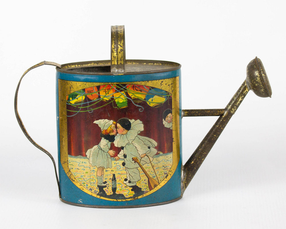 A CHILD'S TIN LITHO WATERING CAN WITH PIERROT 