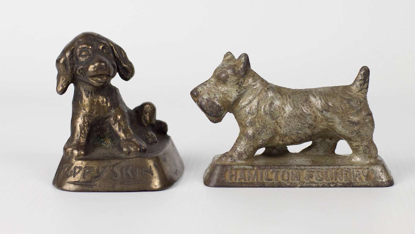TWO DOG THEMED ADVERTISING PAPERWEIGHTS
