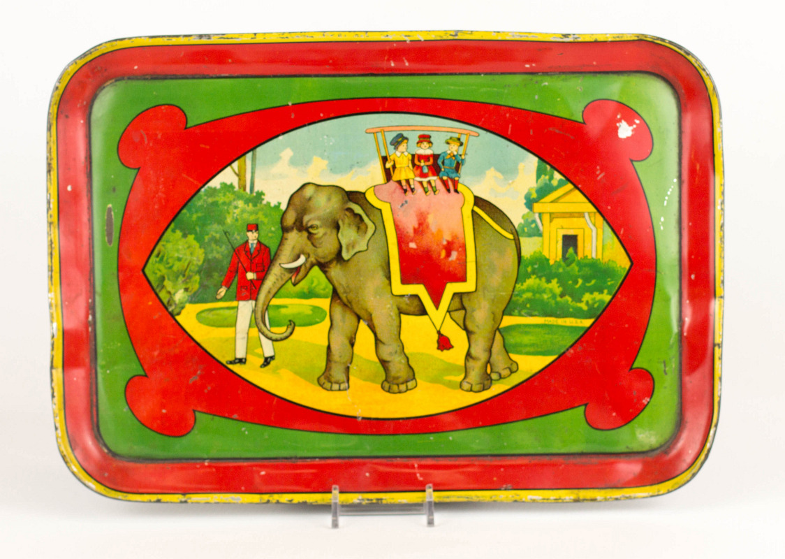TIN LITHO CHILD'S TRAY WITH AN ELEPHANT TRAINER