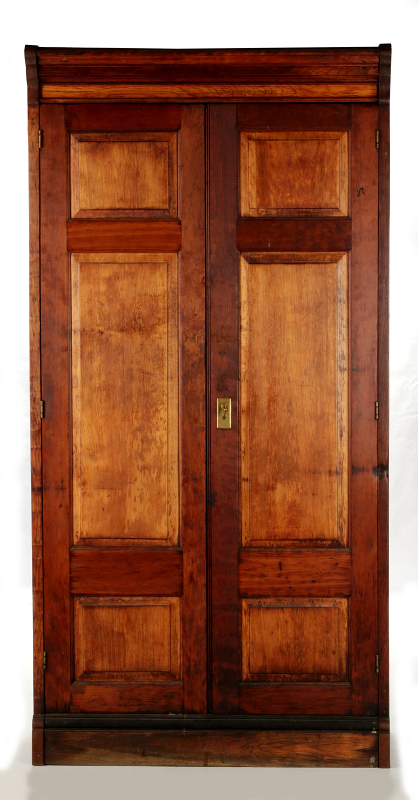  A LATE 19TH CENTURY TWO DOOR RAISED PANEL CABINET