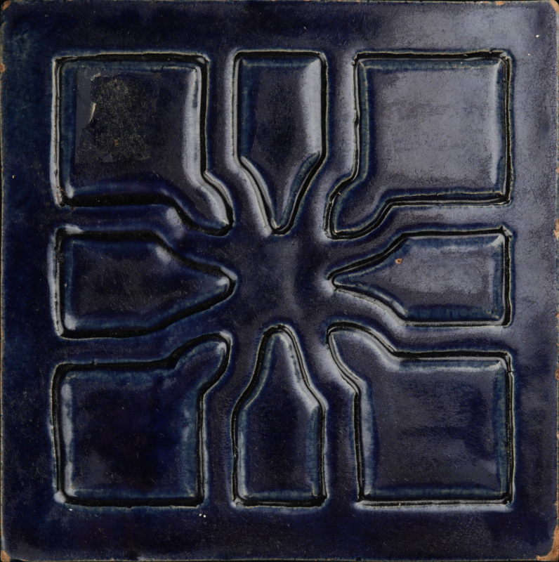 A 1924 CARVED AND GLAZED TILE SIGNED RUTH DUNHAM
