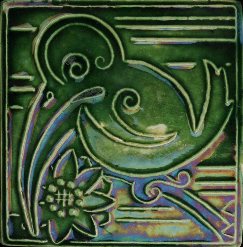 AN EARLY 20TH CENTURY PIPING DECORATED ART TILE