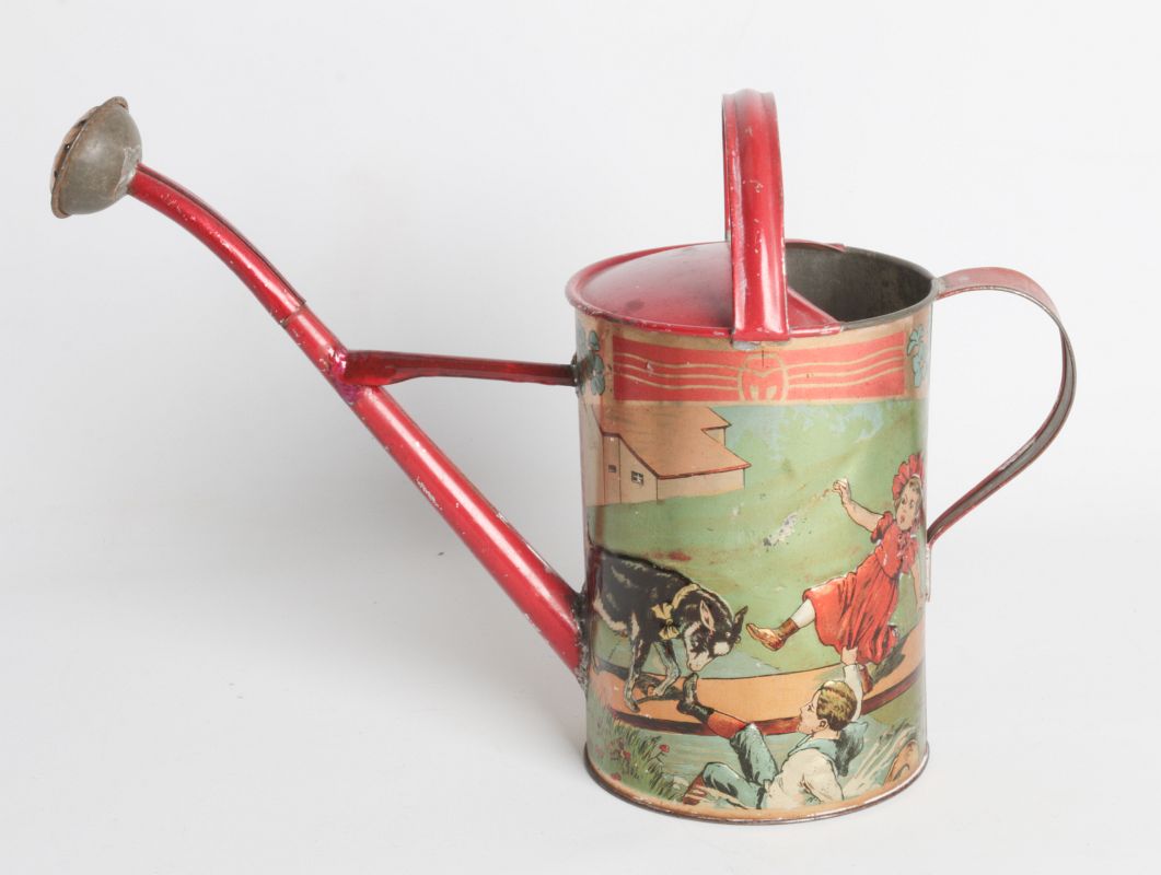 AN EMBOSSED TIN LITHO WATERING CAN