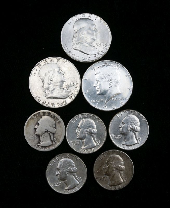 A GROUP OF SILVER $.50, $.25 COINS