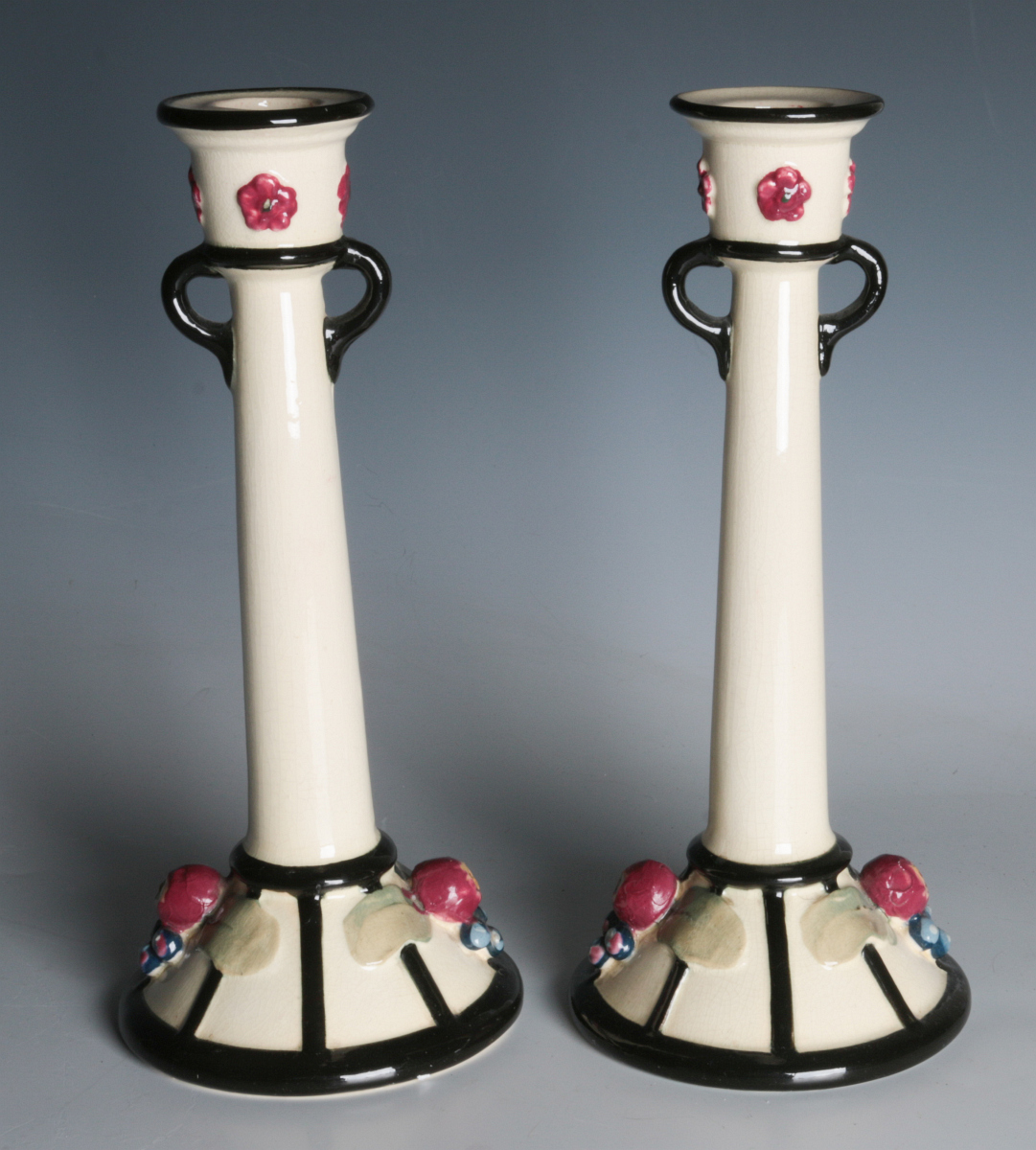 A PAIR OF WELLER ART POTTERY NOVAL CANDLE HOLDERS