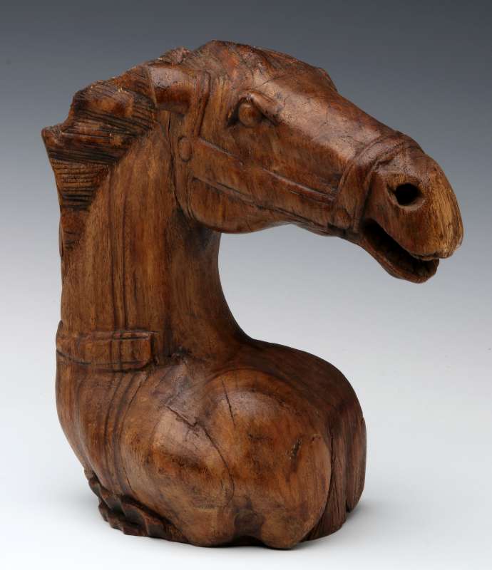 AN ANTIQUE HORSE HEAD WOOD CARVING