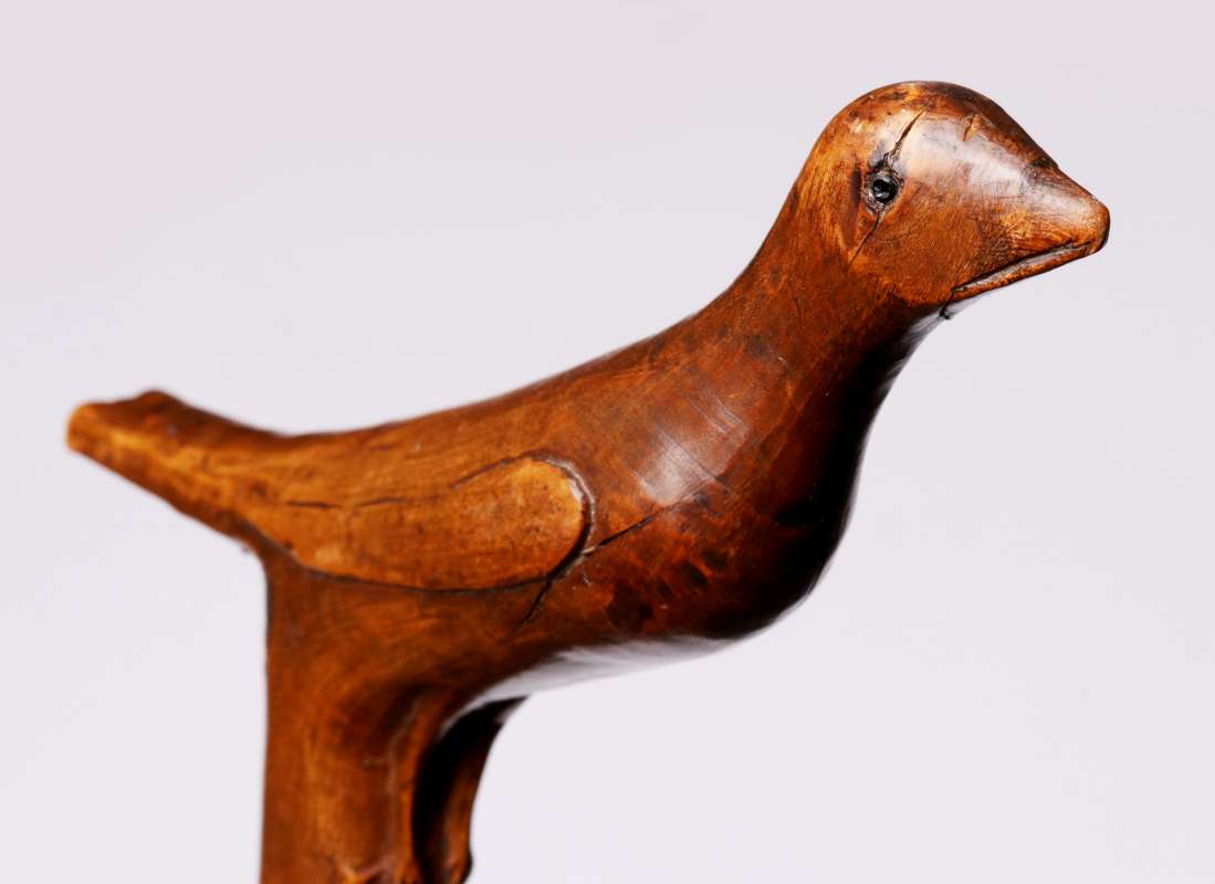 A 19TH C. CARVED FOLK ART CANE WITH BIRD AND SNAKE