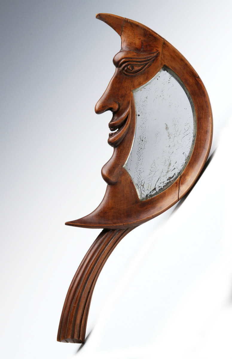 AN EARLY 20TH C. CARVED CRESCENT MOON HAND MIRROR