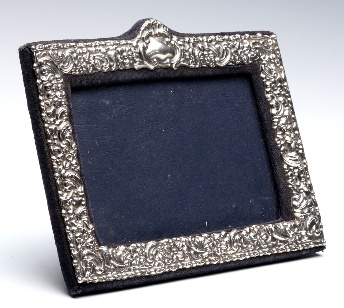 AN EARLY 20TH C.STERLING SILVER REPOUSSE FRAME