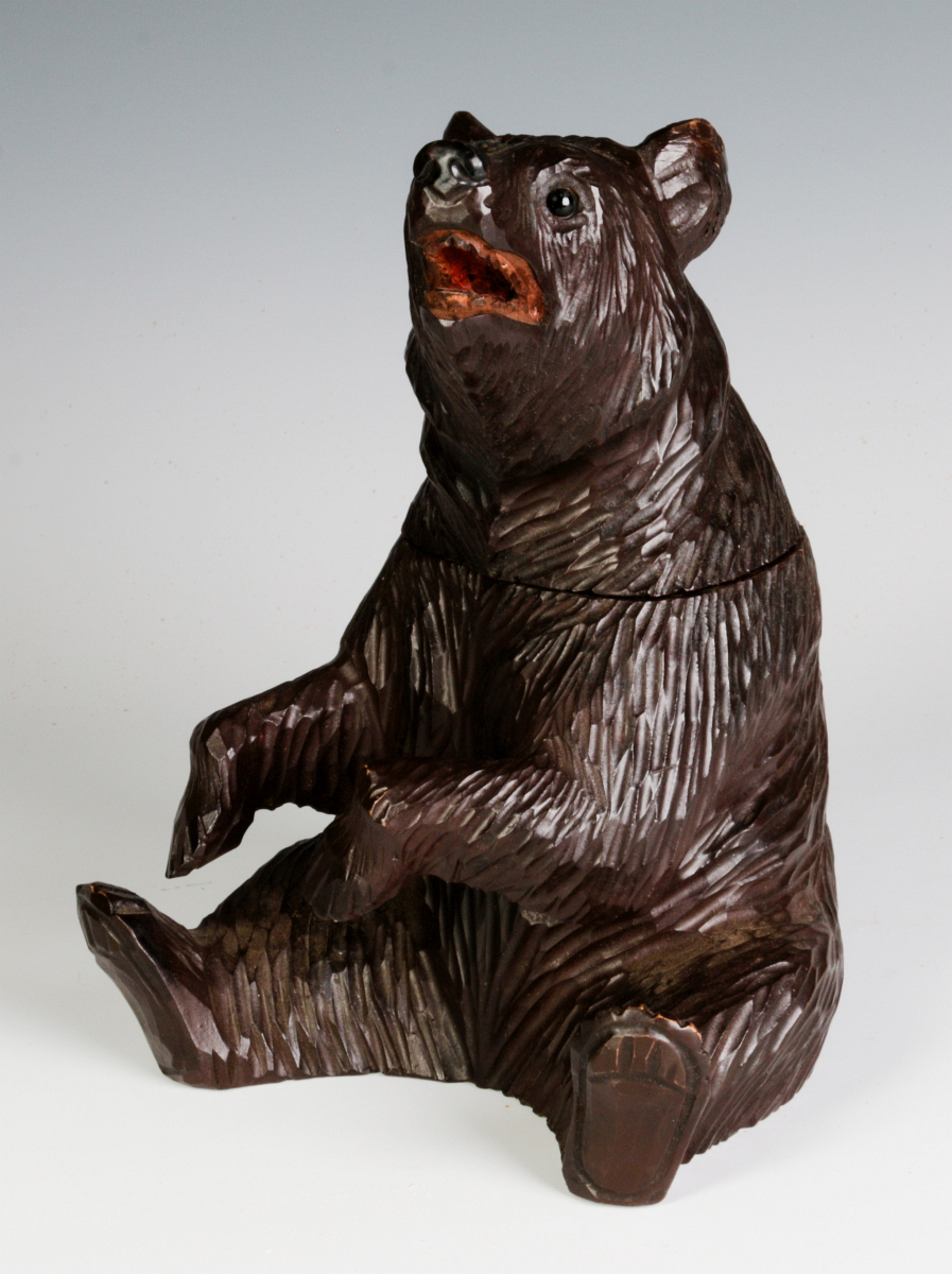 A BLACK FOREST CARVED FIGURAL BEAR CONTAINER