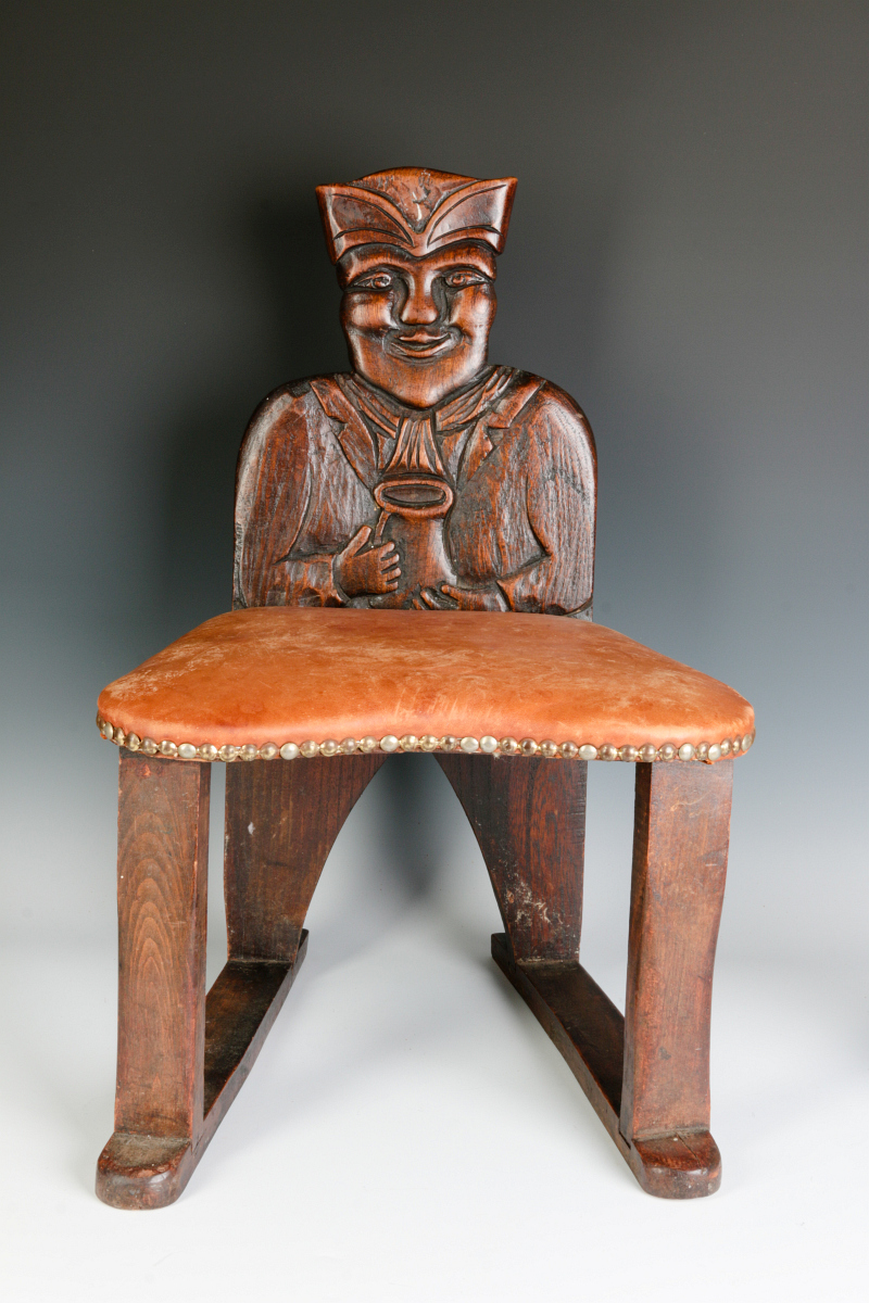 A 19TH C. CARVED CHILD'S CHAIR WITH TOBY FIGURE
