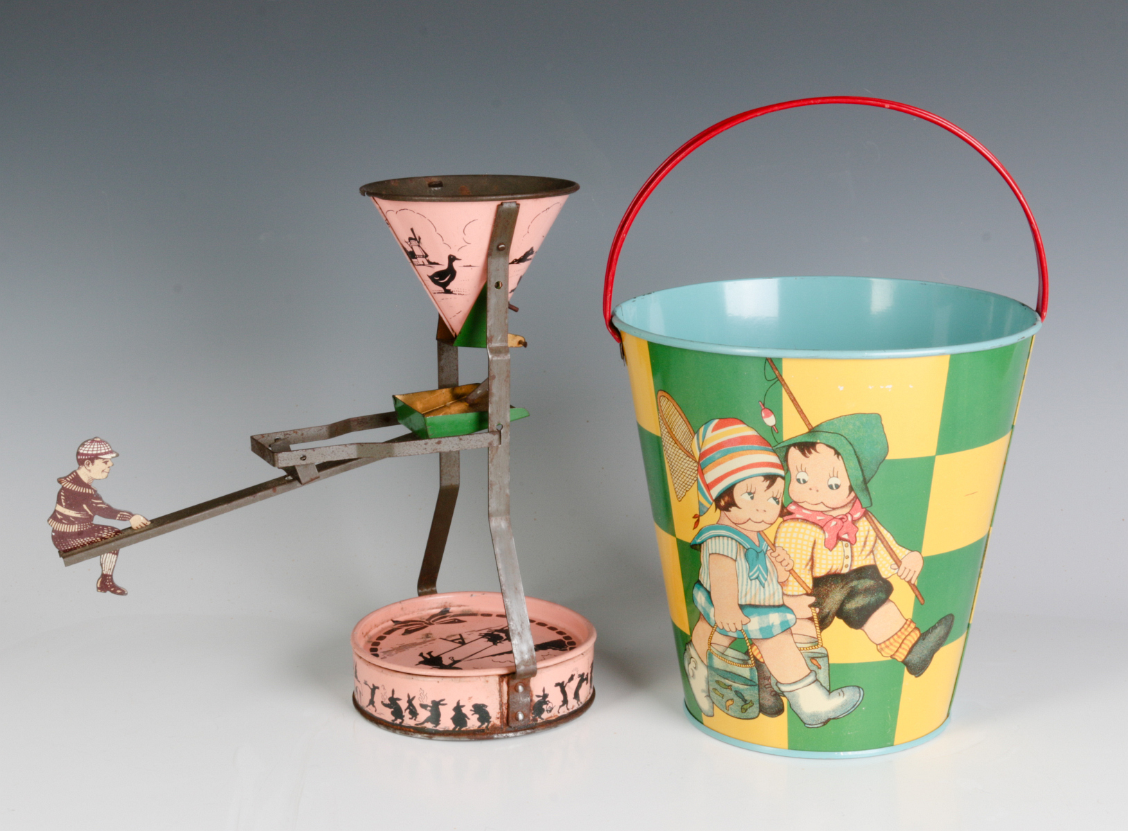 A TIN LITHO SEE-SAW SAND TOY AND NICE CHILD'S PAIL
