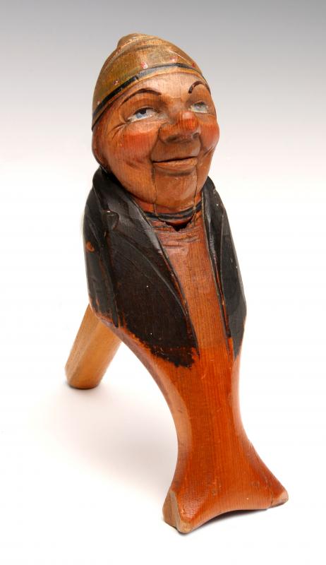 A 19TH CENTURY CARVED AND PAINTED NUTCRACKER