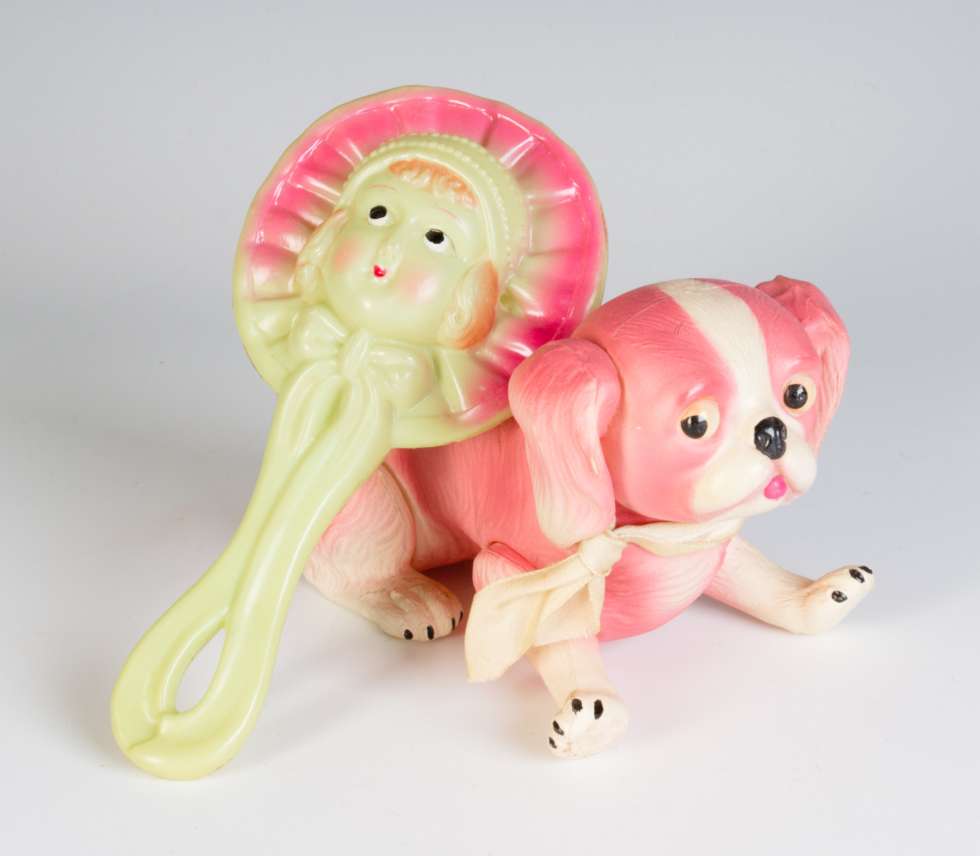 A VINTAGE CELLULOID RATTLE AND DOG FIGURE