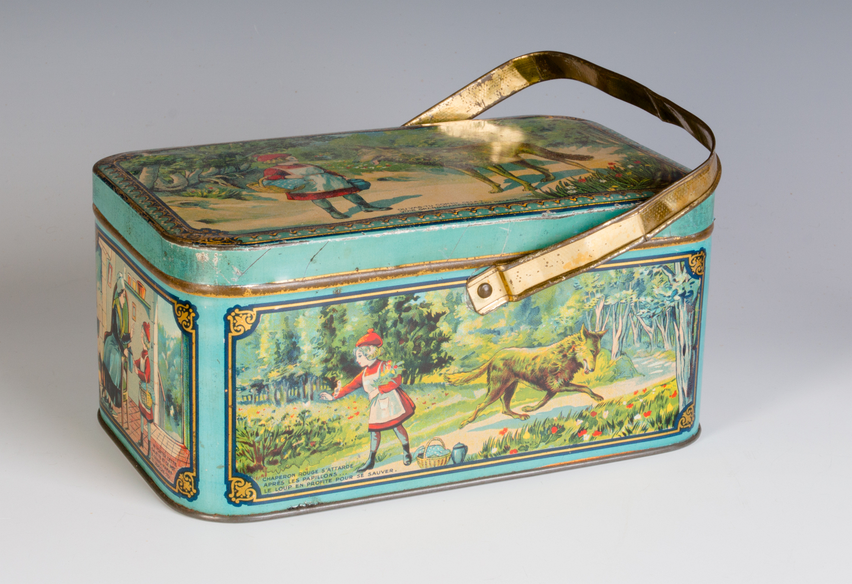 AN ANTIQUE FRENCH TIN LITHO CHILD'S LUNCH TIN
