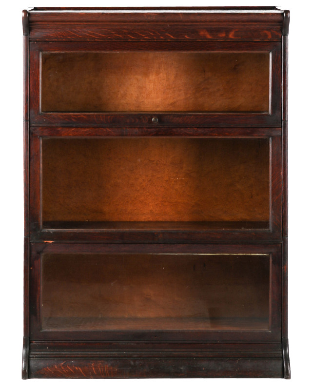 AN ANTIQUE THREE STACK OAK BARRISTER'S BOOK CASE