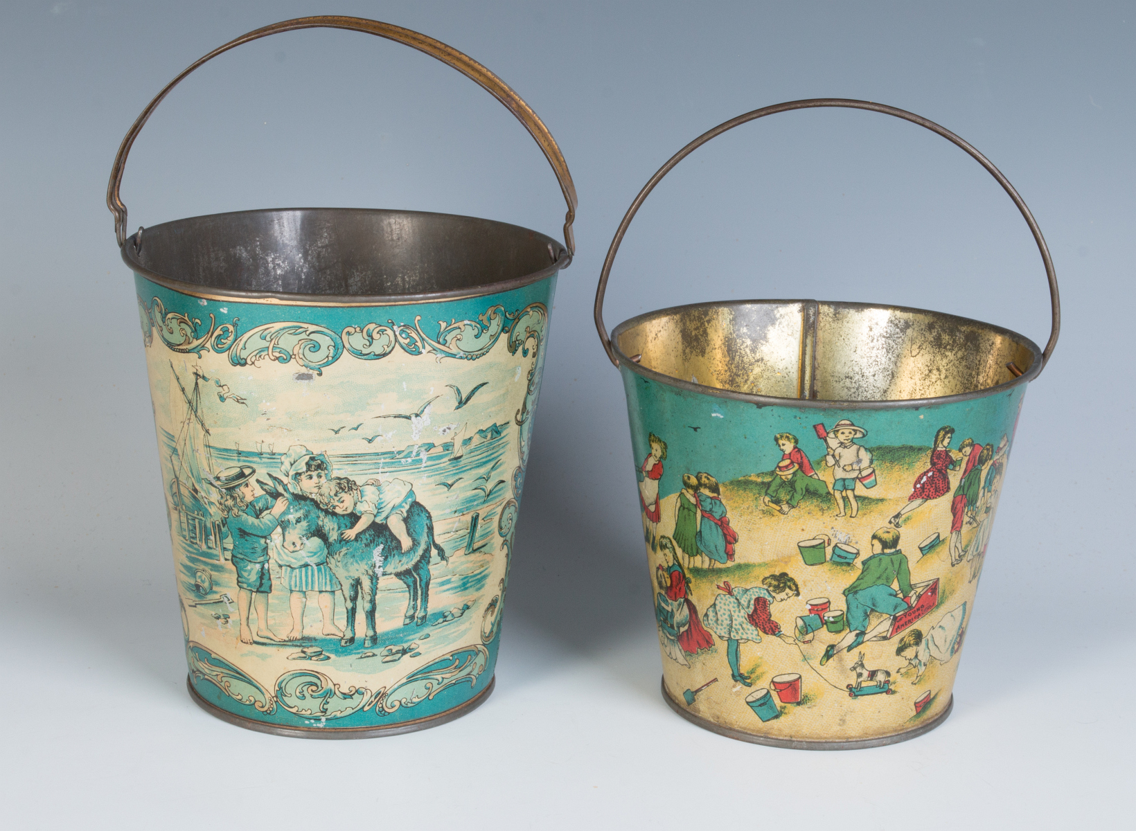 TWO GOOD VICTORIAN TIN LITHO SAND PAILS