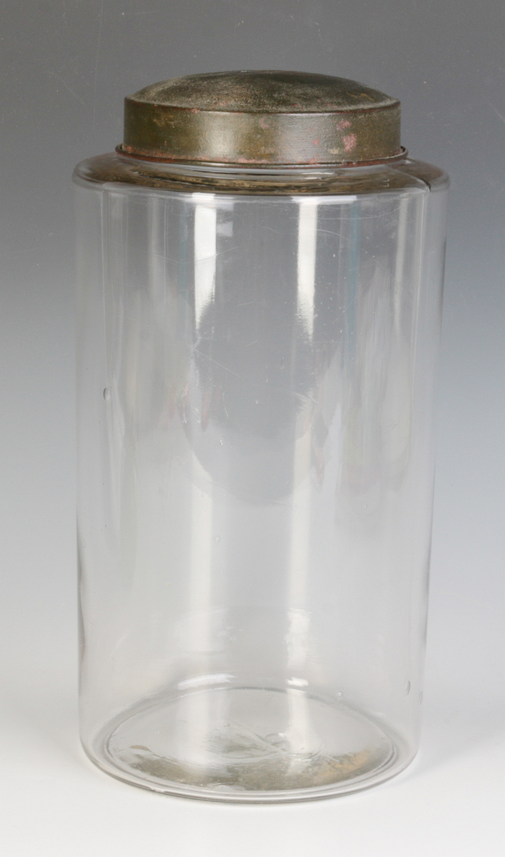 A TALL EARLY BLOWN GLASS STORAGE JAR WITH TOLE LID