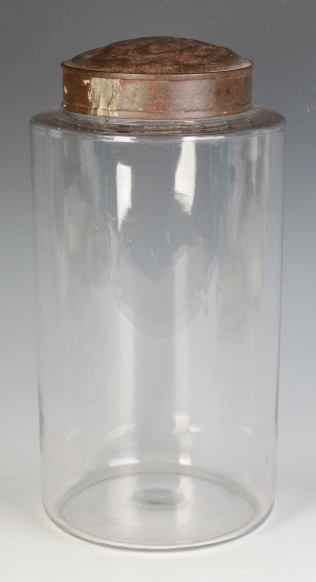 A TALL EARLY BLOWN GLASS STORAGE JAR WITH TOLE LID