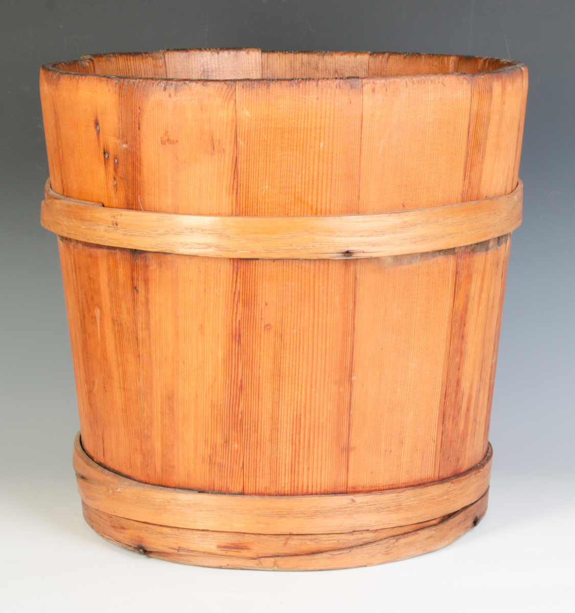 A 19TH CENTURY STAVE BUCKET WITH WOOD BANDS