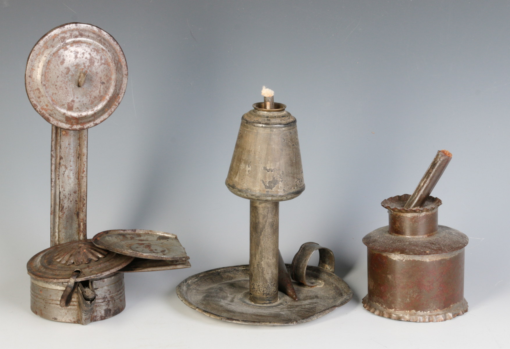 THREE MIDDLE 19TH CENTURY TIN FAT OR GREASE LAMPS