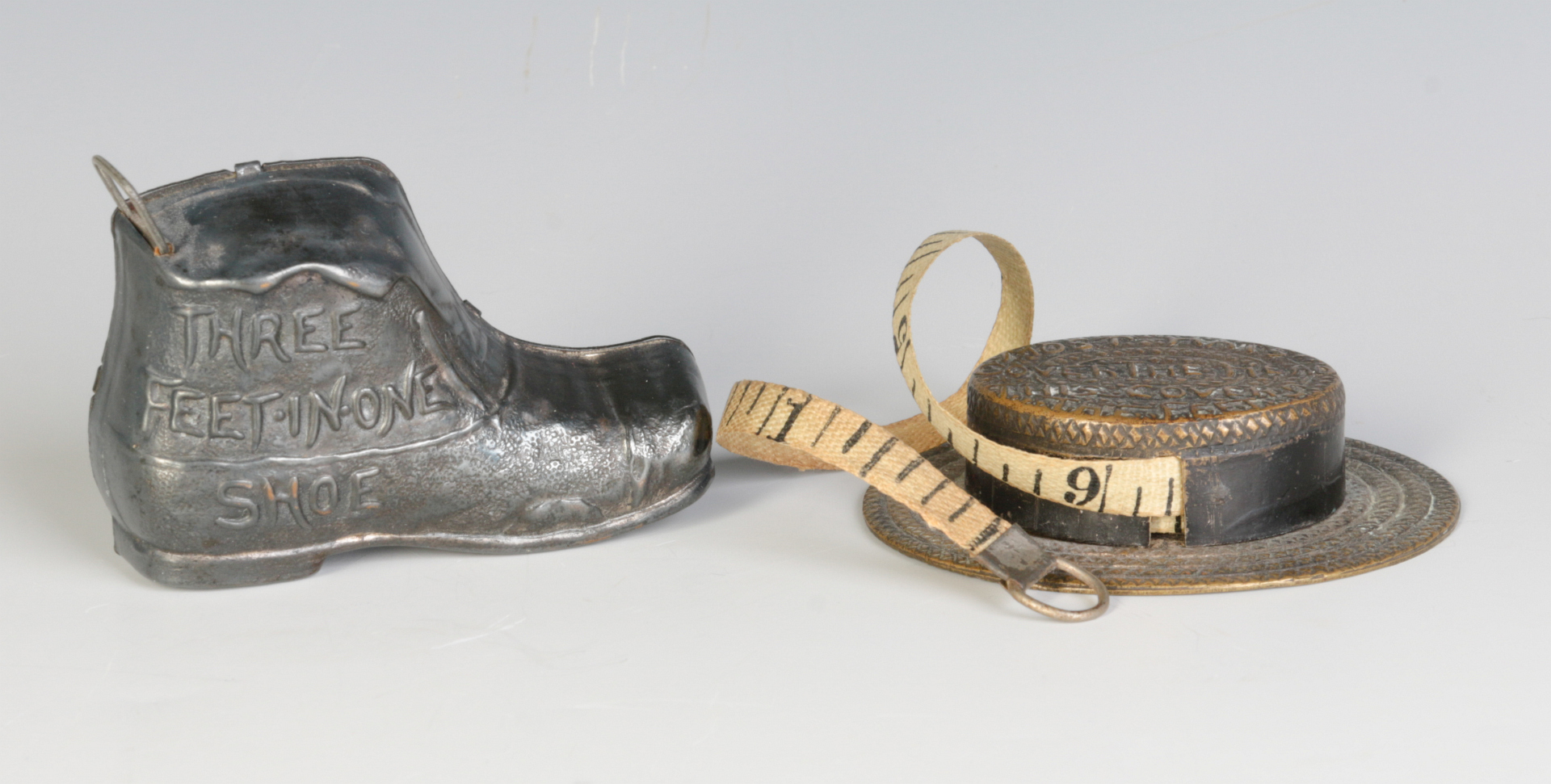 TWO EARLY 20TH CENTURY SEWING TAPE MEASURES