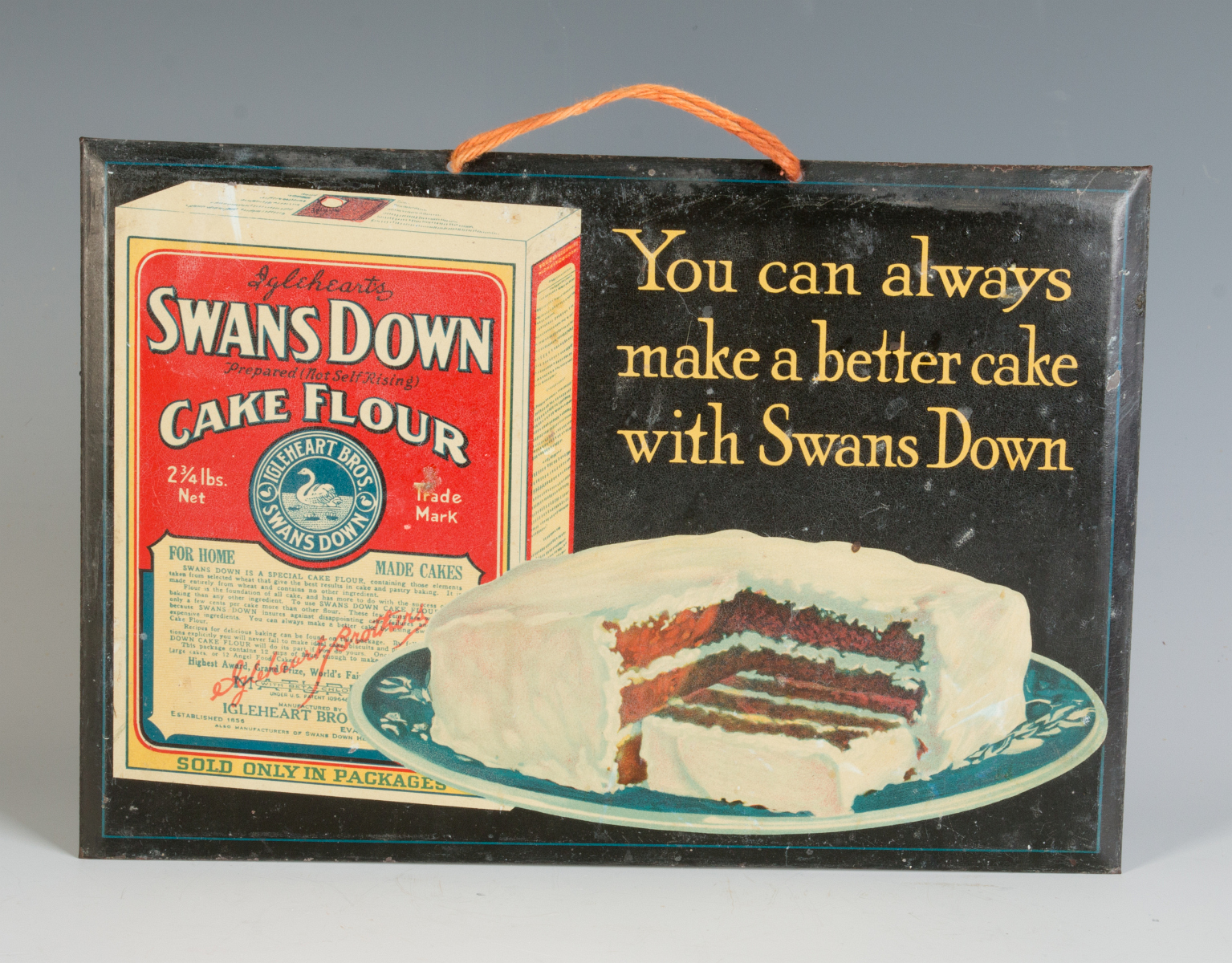 A SWANS DOWN CAKE FLOUR SELF FRAMED TIN SIGN