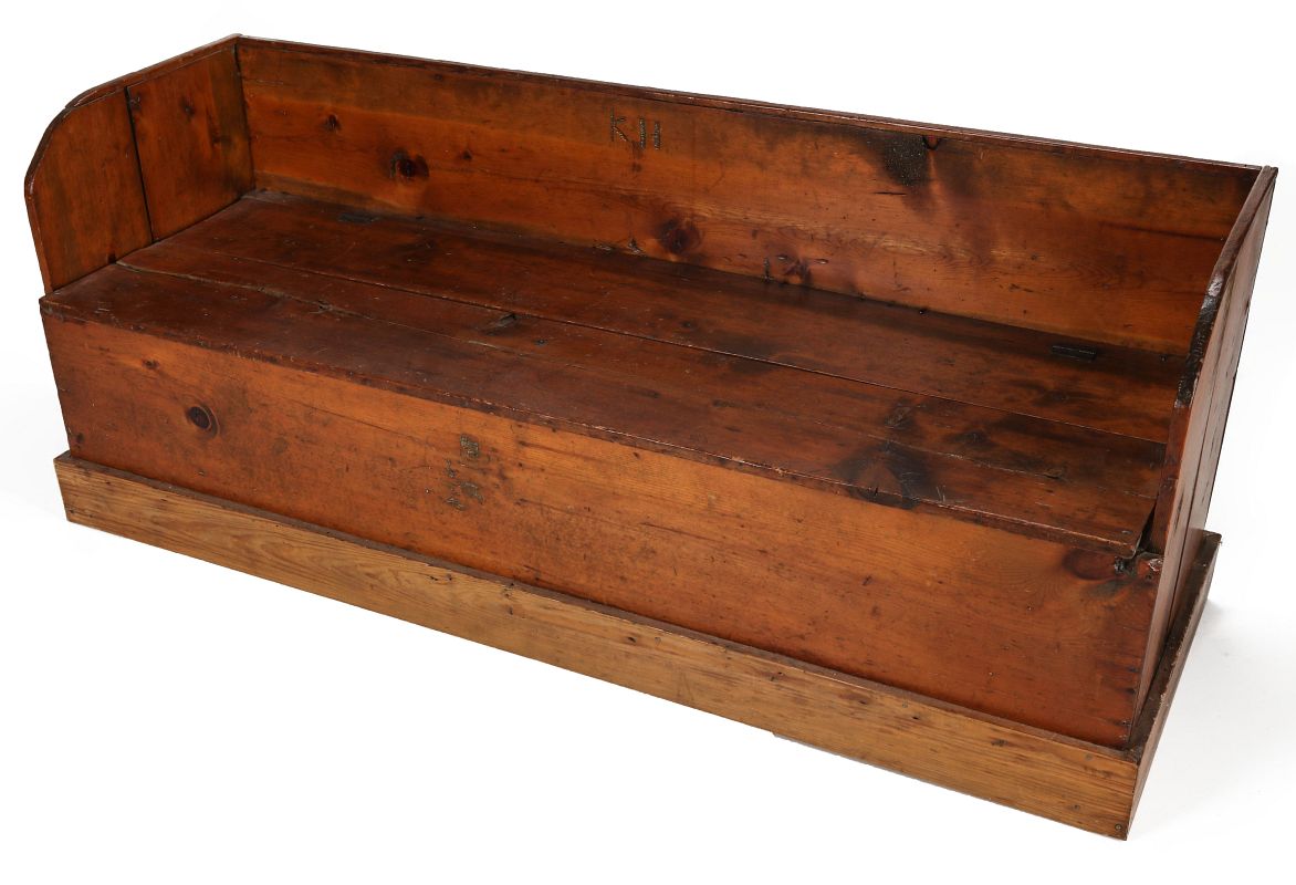 A 19TH CENTURY AMERICAN PINE BENCH WITH LIFT SEAT