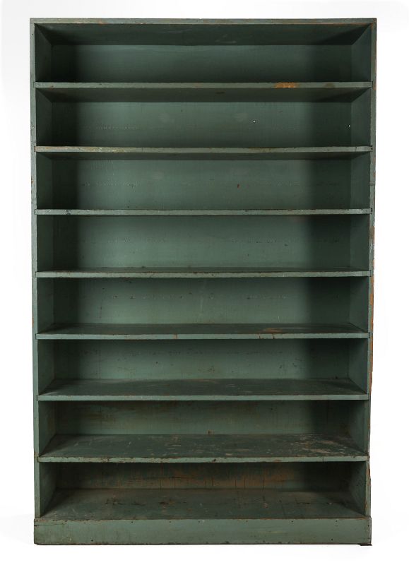 A 20TH CENTURY SHELVING CASE IN GREEN PAINT