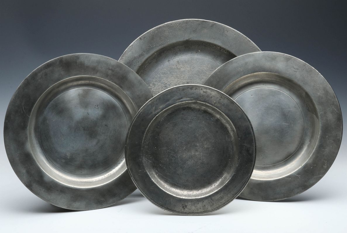 FOUR EARLY TO MID 19TH CENTURY PEWTER PLATES