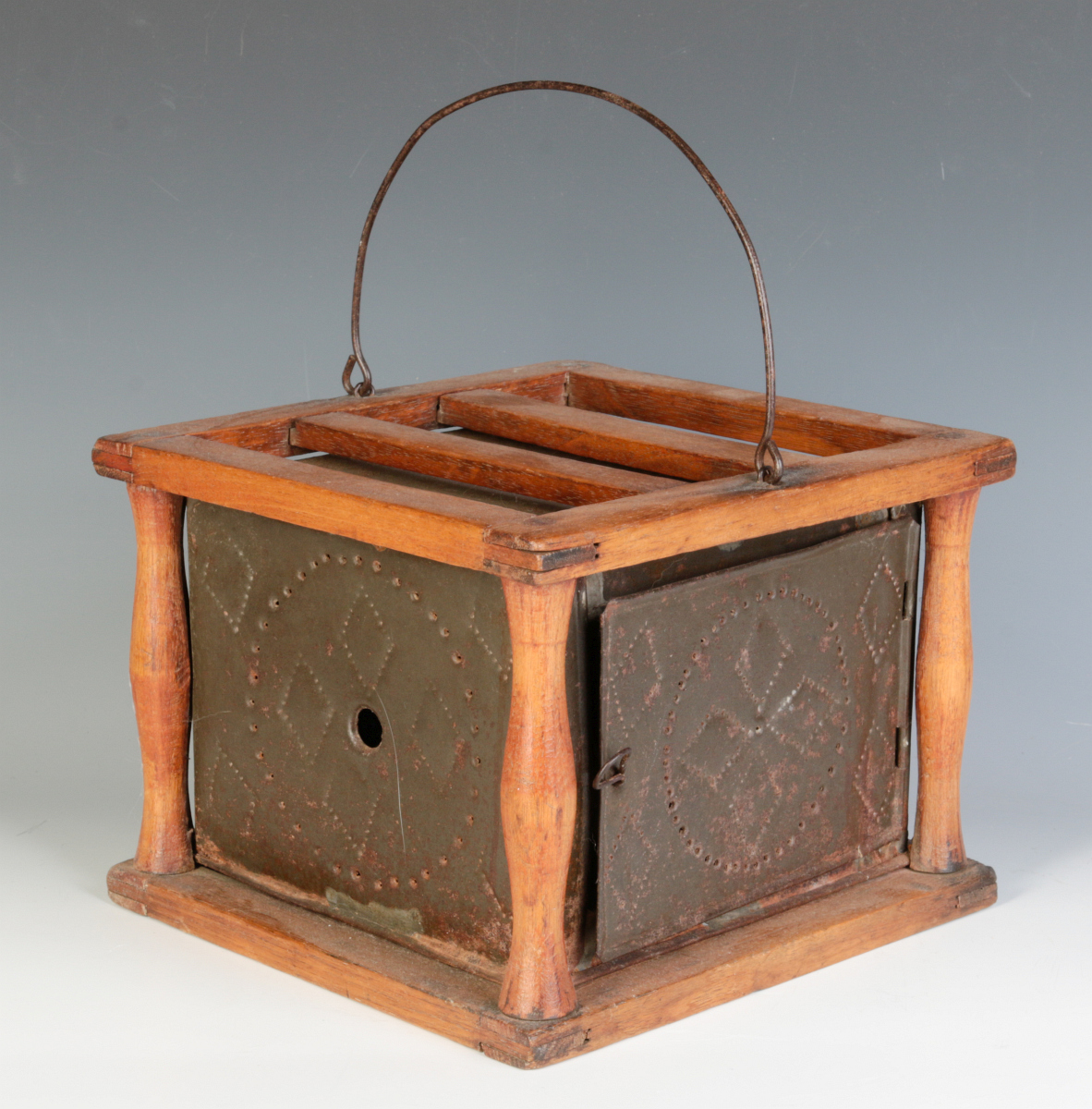 A 19TH C. WOOD FRAME FOOT WARMER WITH PUNCHED TINS