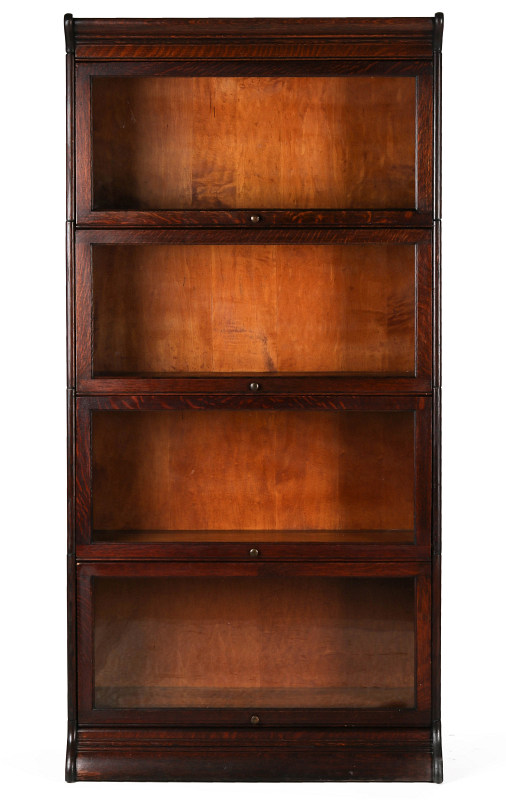 AN ANTIQUE FOUR STACK OAK BARRISTER'S BOOK CASE