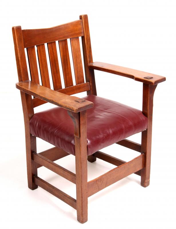 A MAHOGANY V-BACK MISSION STYLE ARM CHAIR c. 1900