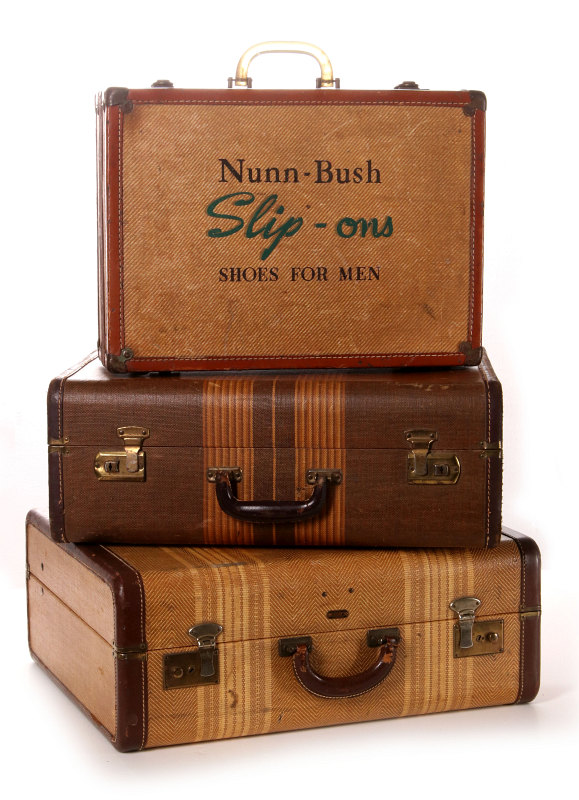 STACKED VINTAGE LUGGAGE WITH NUNN-BUSH ADVERTISING