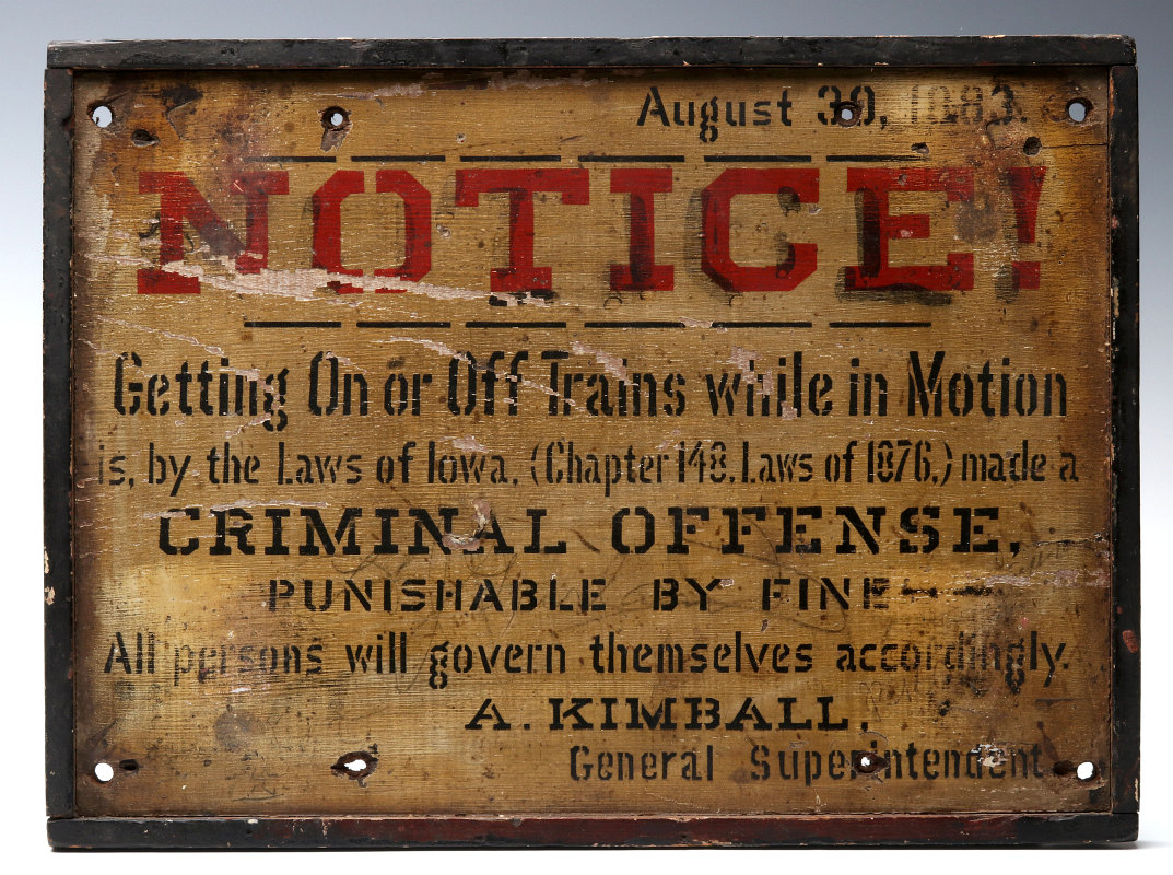 A PAINTED WOOD IOWA RAIL YARD SIGN DATED 1883
