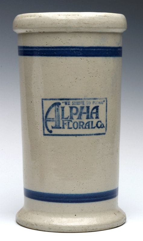 AN ALPHA FLORAL STONEWARE VASE BY RED WING POTTERY