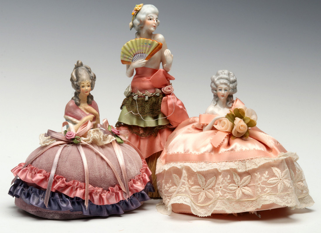 PORCELAIN PINCUSHION DOLLS AND WHISK
