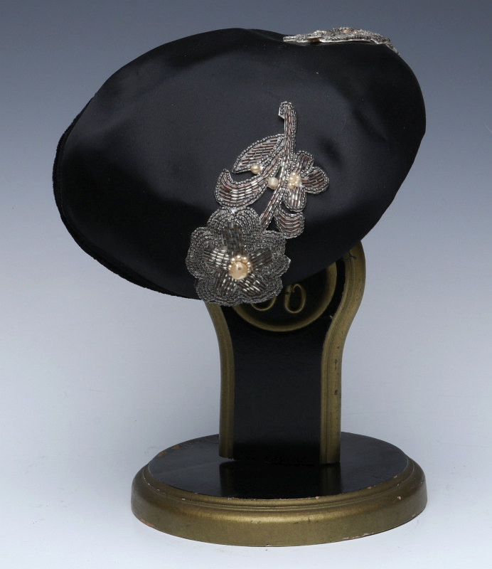 A VINTAGE HAT STAND AND HAT