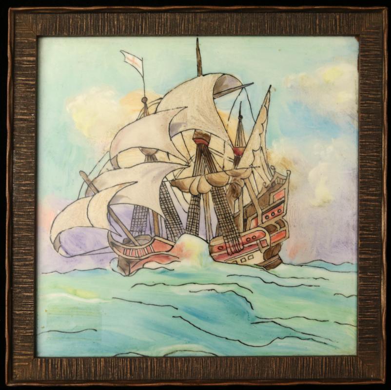 A HAND DECORATED ART TILE WITH A SAILING SHIP