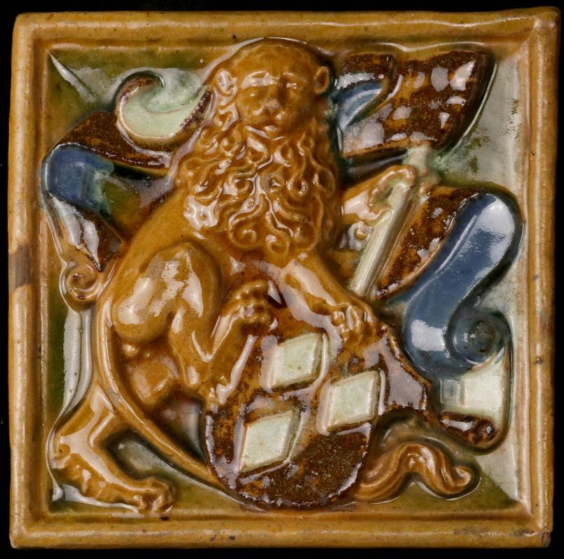AN ANTIQUE HERALDRY THEME ART TILE WITH LION