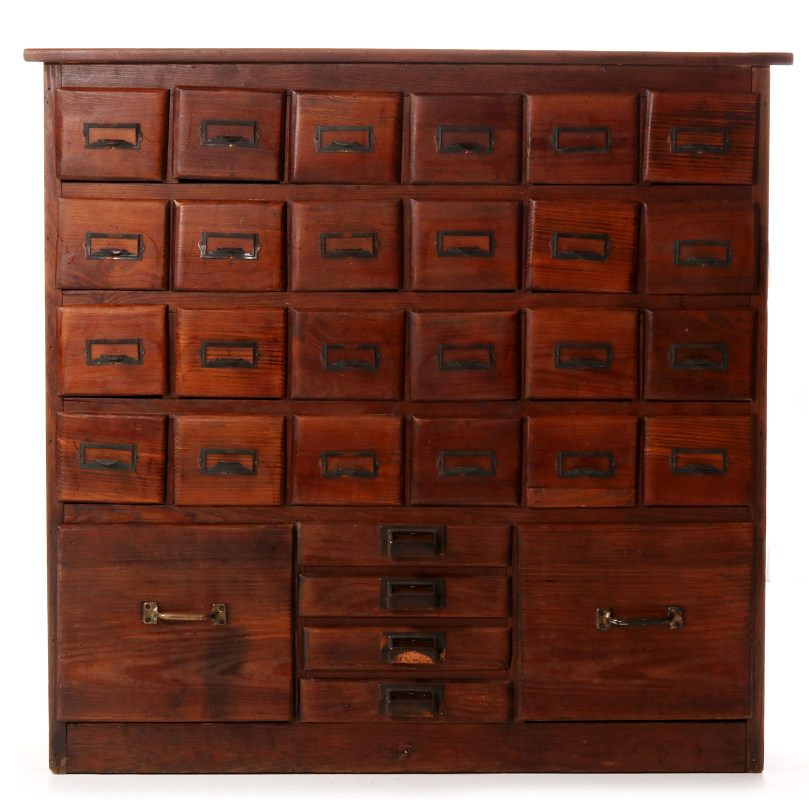 A MULTI-DRAWER YELLOW PINE STORE CABINET C. 1920