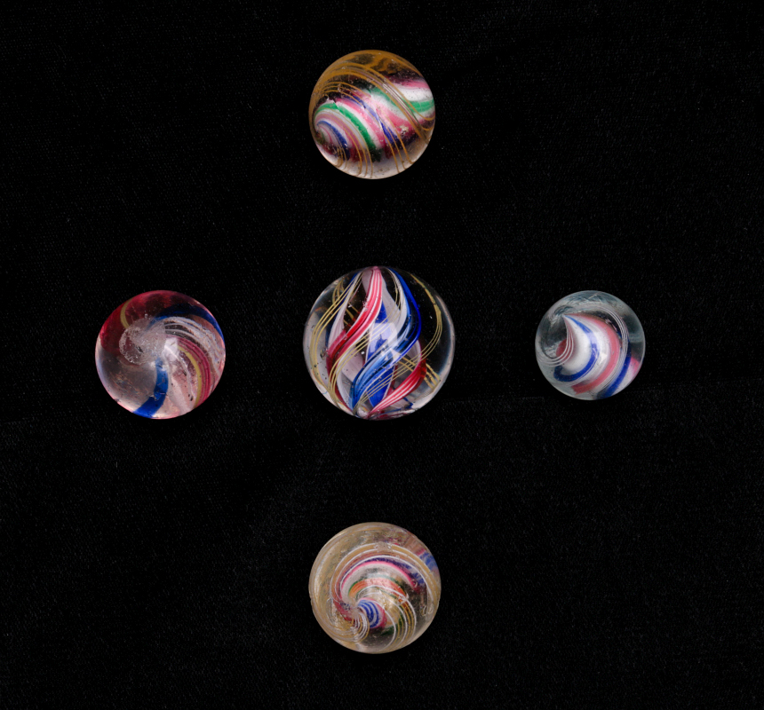 A COLLECTION OF LATTICINIO AND SOLID CORE MARBLES