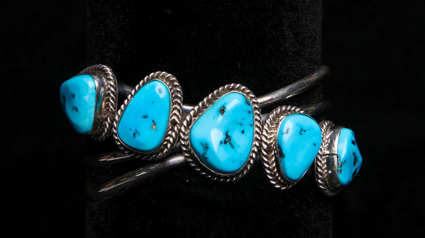 A NAVAJO STERLING AND TURQUOISE CUFF BRACELET