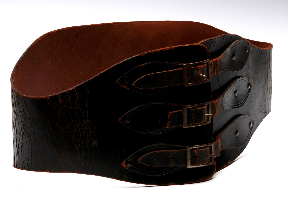 A VINTAGE LEATHER MOTORCYCLE RIDER'S BELT