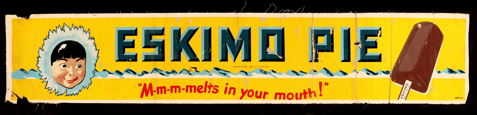 AN ESKIMO PIE PAINTED CANVAS ADVERTISING BANNER