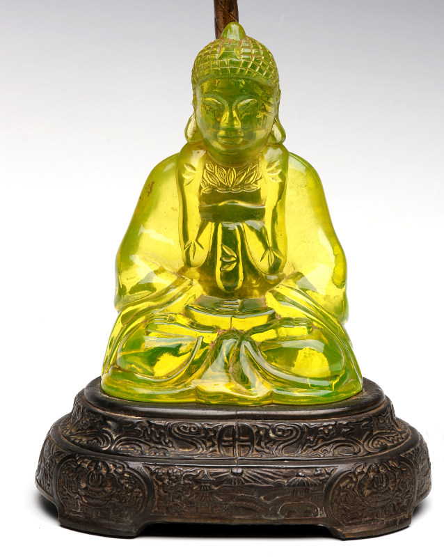AN UNUSUAL VASELINE GLASS FIGURAL BUDDHA LAMP