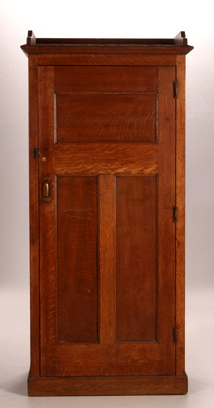 A SMALLER ONE DOOR OAK WARDROBE WITH PANELED SIDES