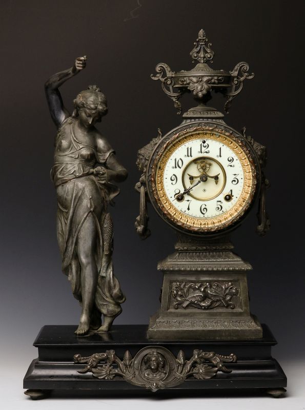 AN ANSONIA STATUE CLOCK WITH CLASSICAL MAIDEN