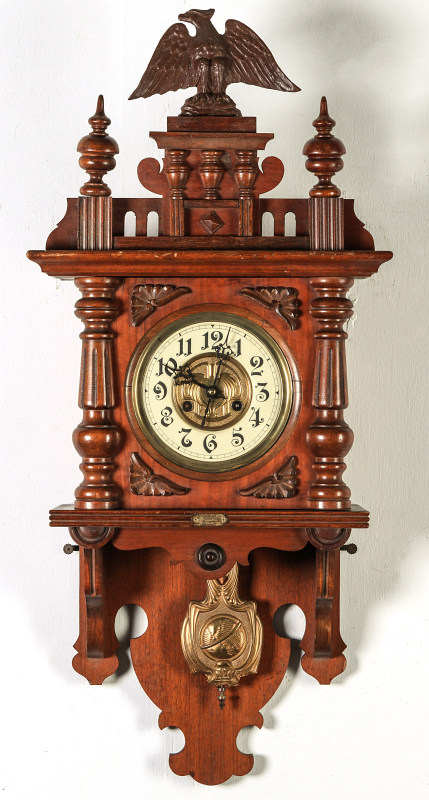 AN ORNATE JUNGHANS OPEN WAG WALL CLOCK WITH EAGLE
